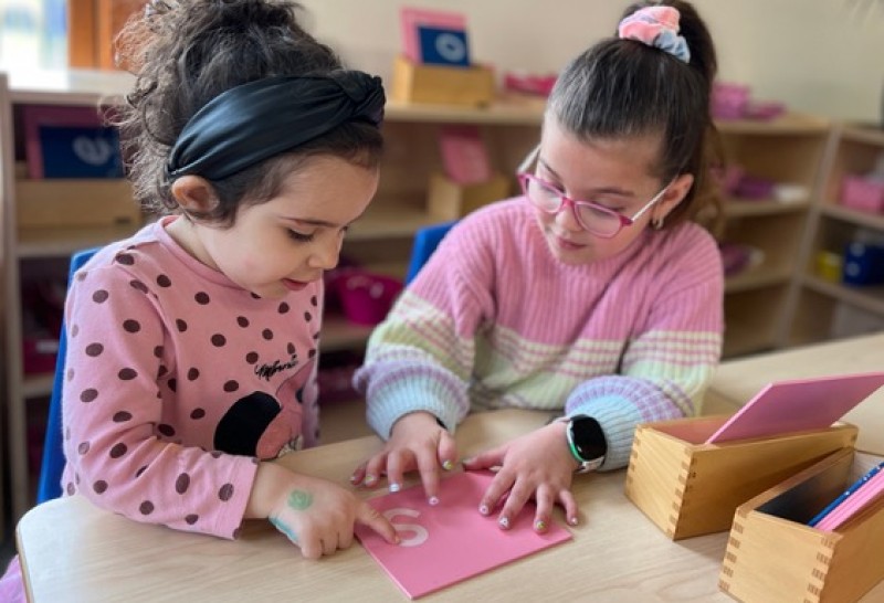 pink girls Girls in a Montessori classroom